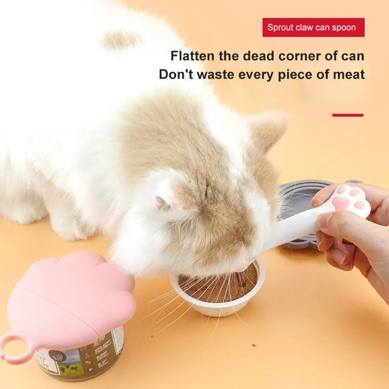 Multifunction silicone pet food spoon and can opener with pink lid, 5.1 inches long, paw-shaped scoop, white background