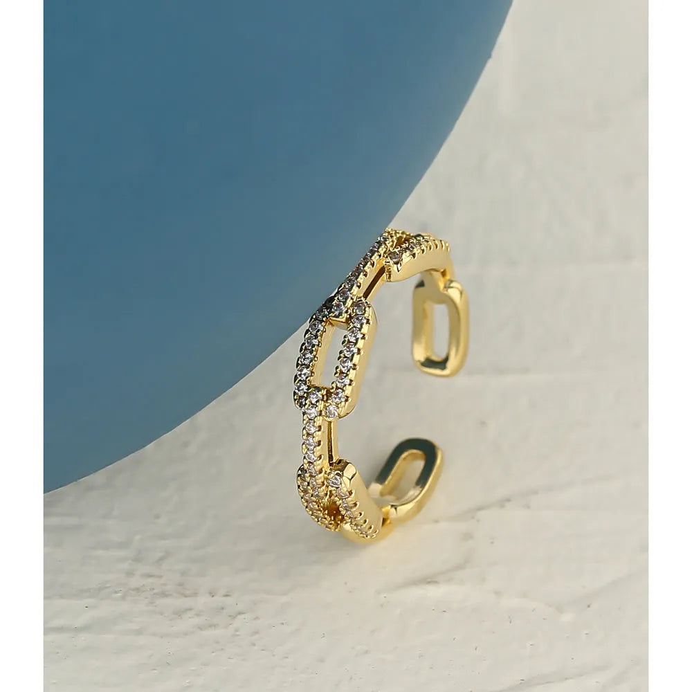 Gold ladies' ring with chain-style design encrusted with micro-inlaid CZ zircon stones, adjustable opening, copper base