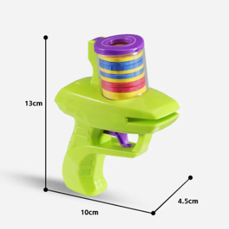 Green durable plastic cat toy launcher with a foam disc ready for launch.