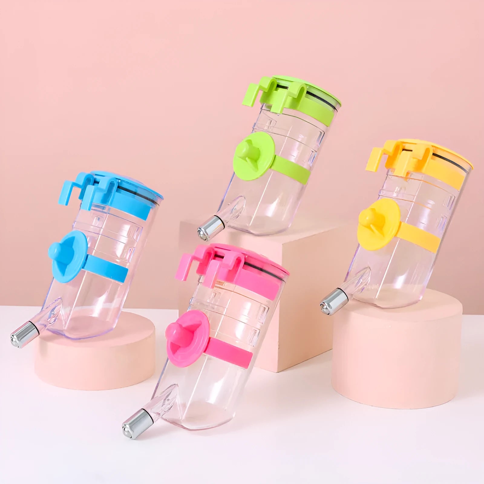 No drip dog kennel water bottle dispenser with dripless nozzle, hanging in a crate, available in blue, green, pink, and yellow