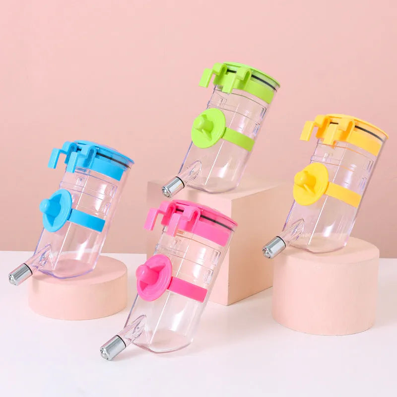 No drip dog kennel water bottle dispenser with dripless nozzle, hanging in a crate, available in blue, green, pink, and yellow