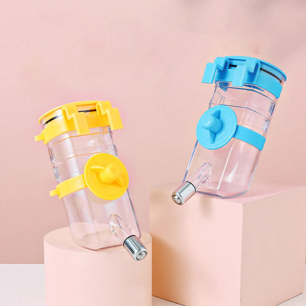 No drip dog kennel water bottle dispenser with dripless nozzle, hanging in a crate, available in blue, green, pink, and yellow