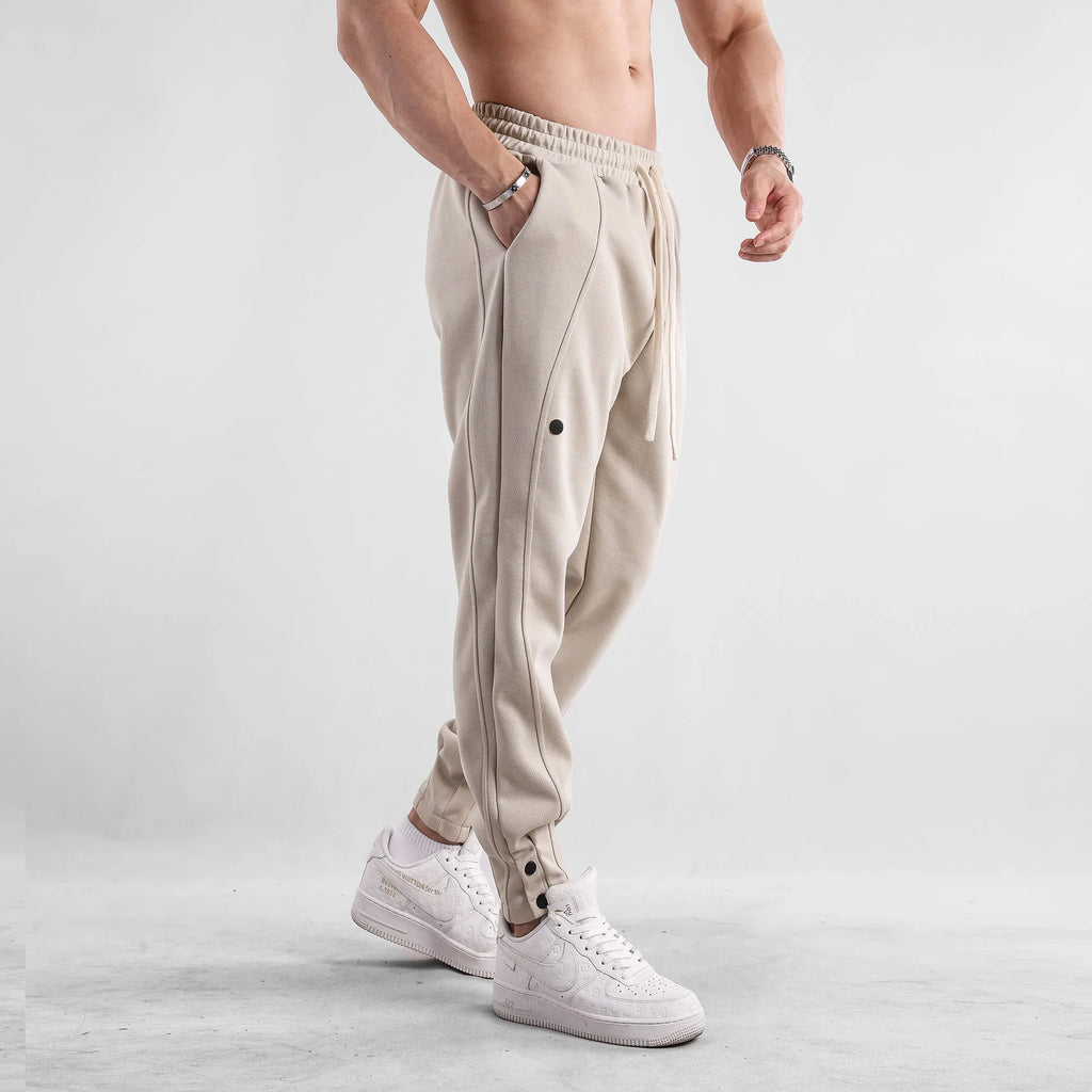 Men's cotton loose fit casual sports trousers in light blue, side view, with mid waist and straight leg