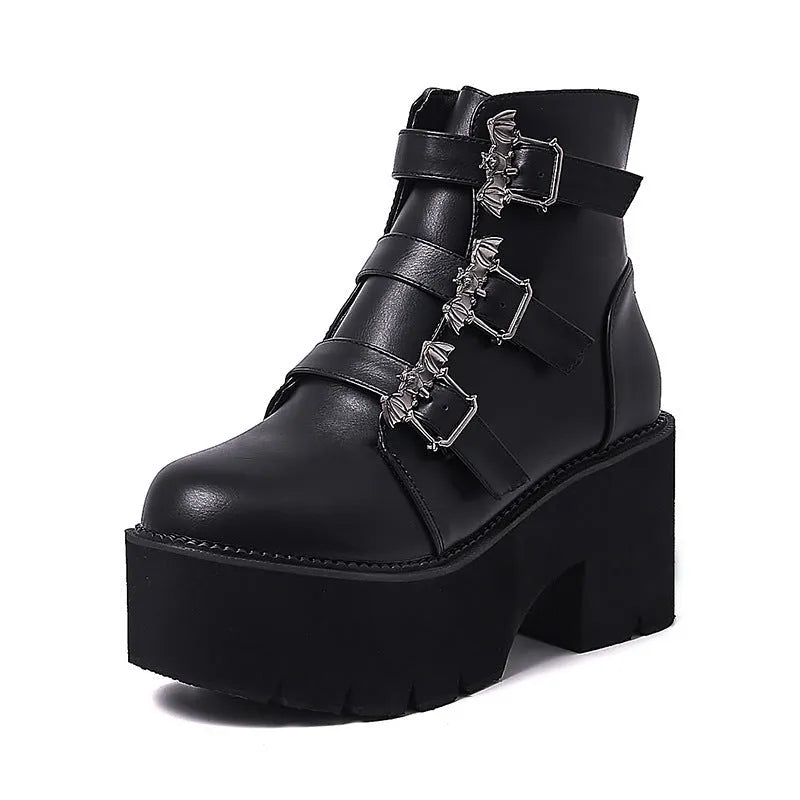 Black women's punk boots with bat buckle, side zip, thick heel, and round toe.