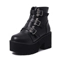Black women's punk boots with bat buckle, side zip, thick heel, and round toe.