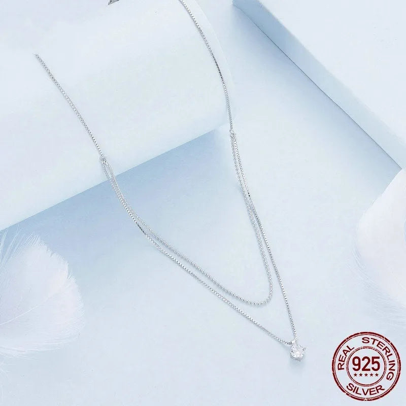 Women's double-layer sterling silver necklace with pearl chain detail in polished silver colour