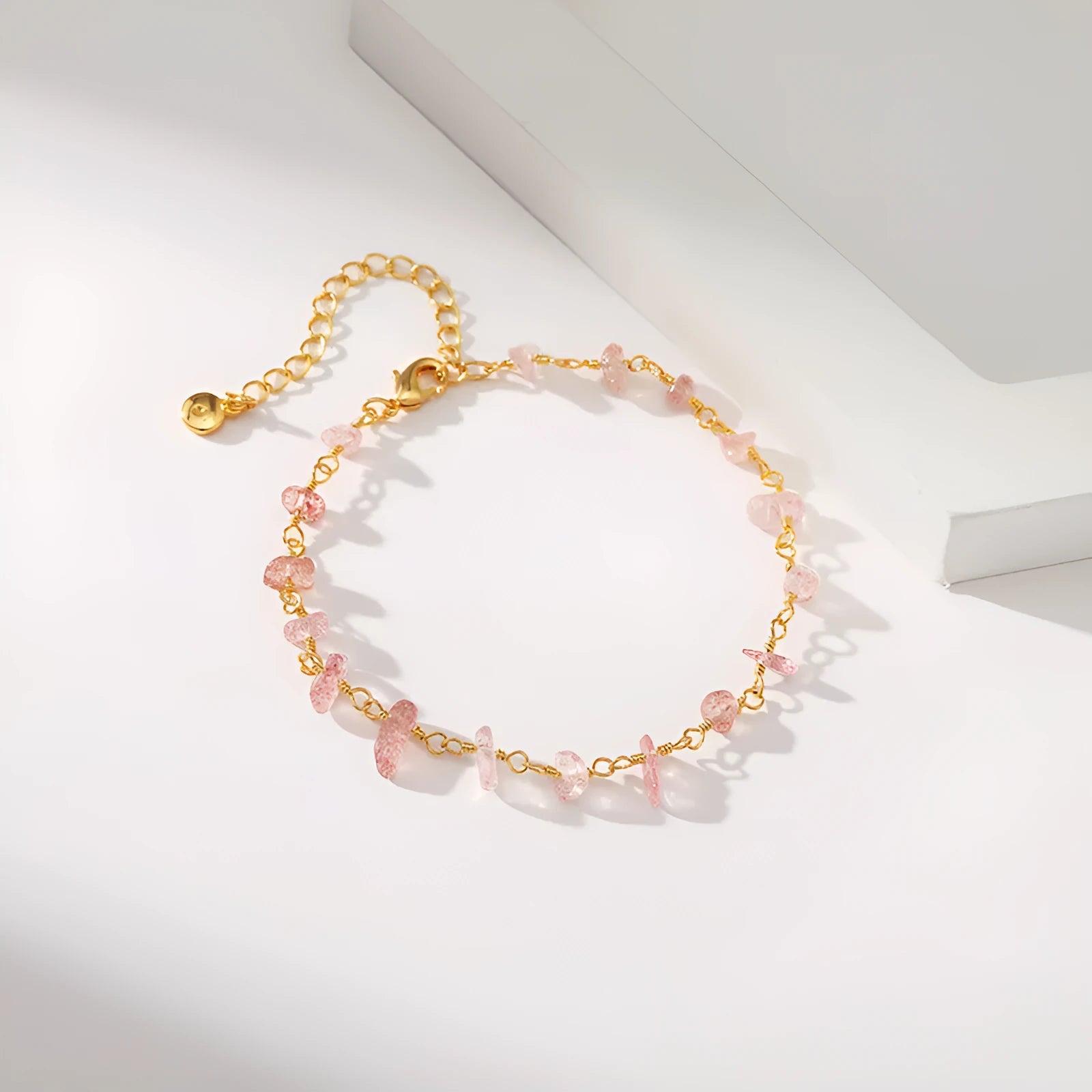 Geometric women's bracelet with irregular turquoise stones and crystal details on 18K copper