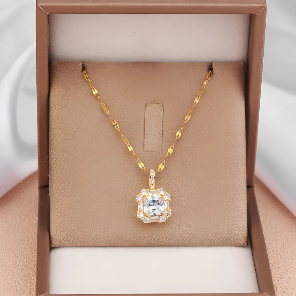 Gold geometric quadrilateral pendant necklace with mixed gemstones on a water wave chain.