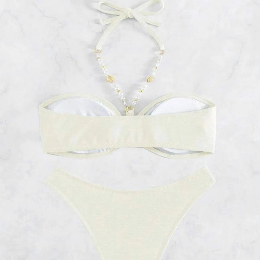 Women's solid colour halter bikini set in creamy-white, shown front-on.