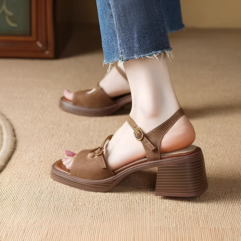 Women's open toe square toe retro platform sandals in milky white colour on a neutral background.