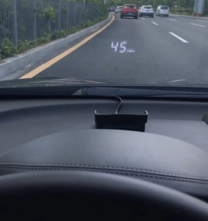 A100 OBD II head up display projecting vehicle speed on windscreen, with white or green light option