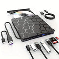 Black external USB CD DVD writer drive with compact slim design on a desk.