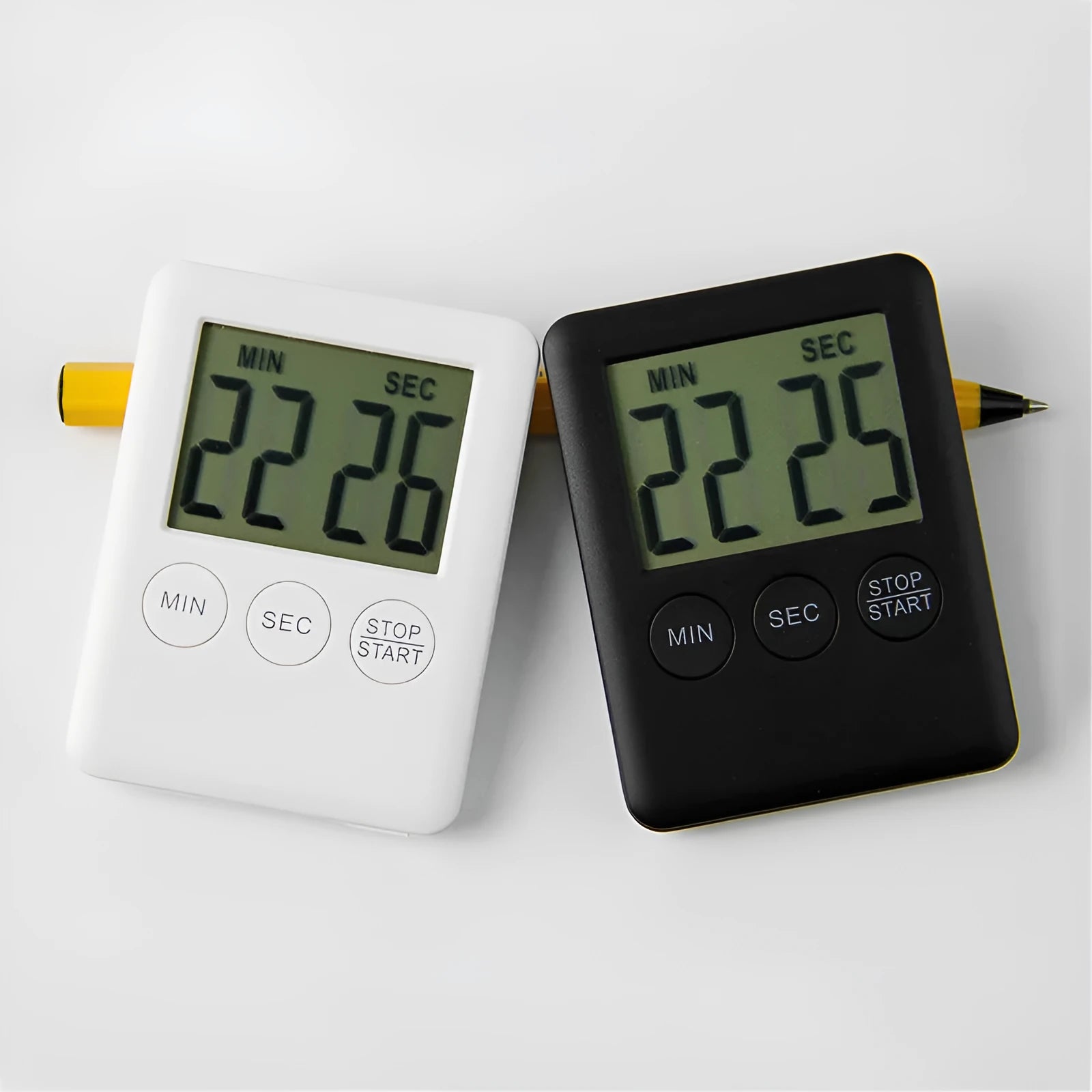 Digital kitchen timer with magnetic back in black and white colour options showing countdown display