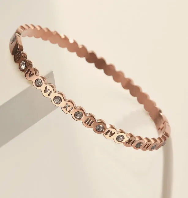 Korean style titanium steel bracelet with numerical design in gold, rose gold, and steel colour options.