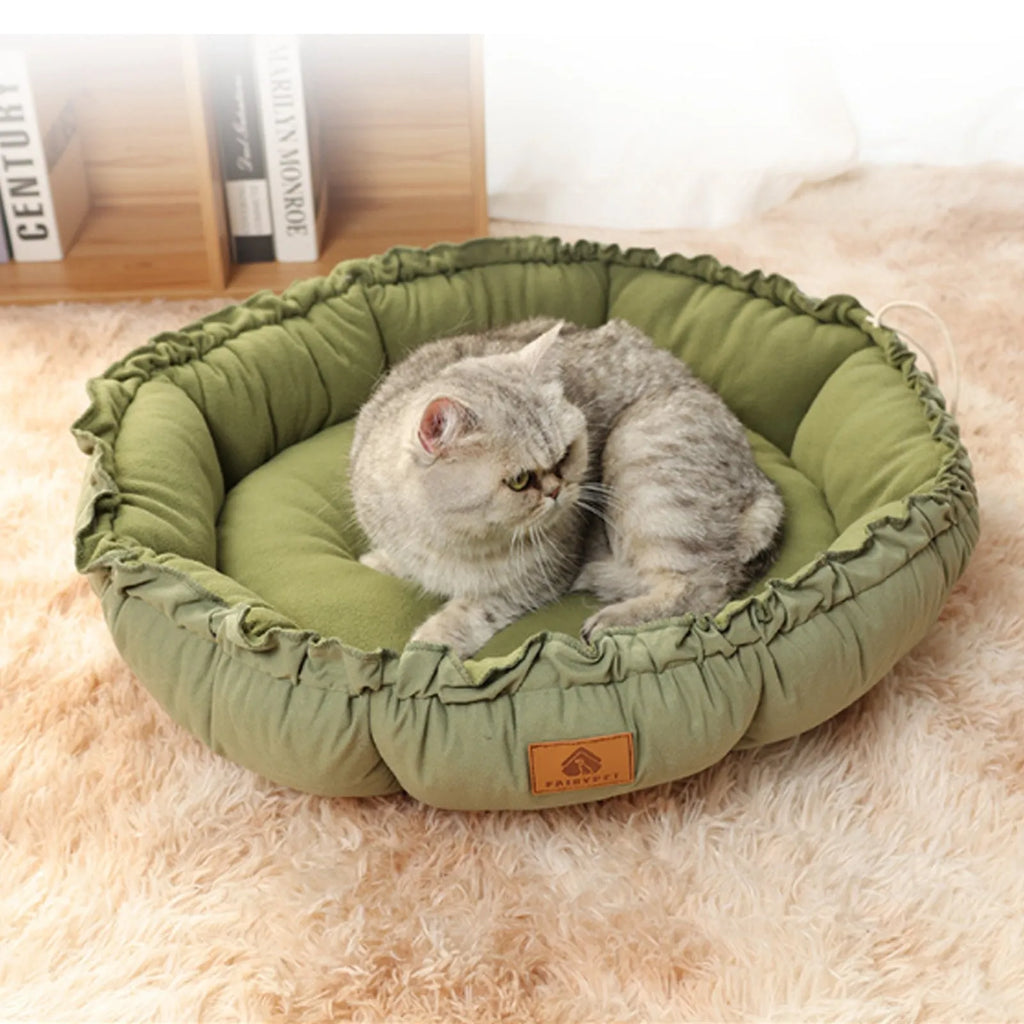 Grey and green reversible donut cat bed for indoor pets in small, medium, large sizes.