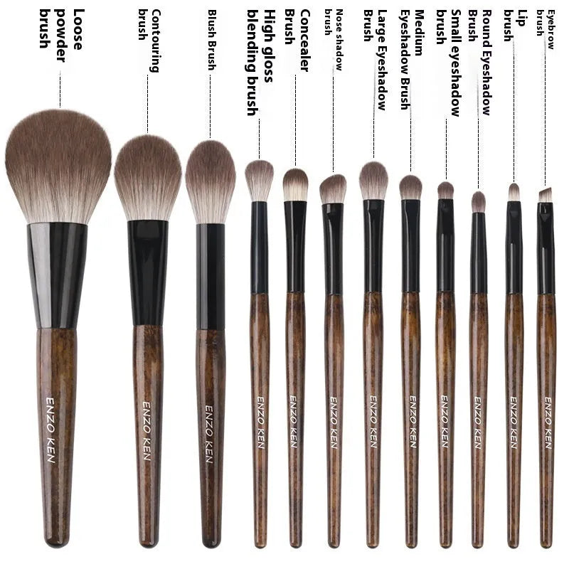 12-piece makeup brush set with wooden handles and a grey PU storage pouch.