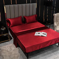 Artificial silk fitted sheet with elastic band in plain pattern, available in black and other colours