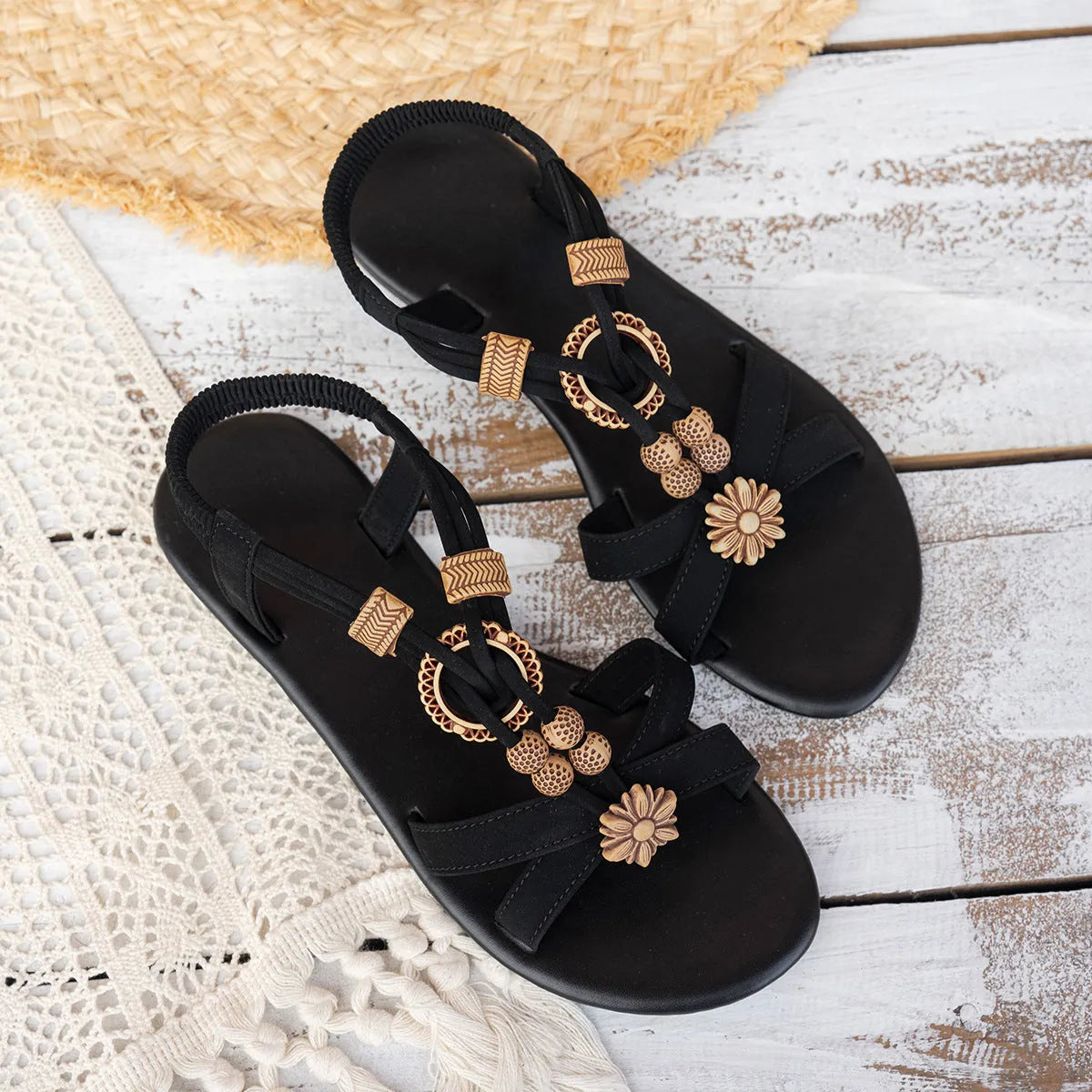 Women's black ethnic style flat sandals with beaded weave pattern, open toe design, and elastic band fastening