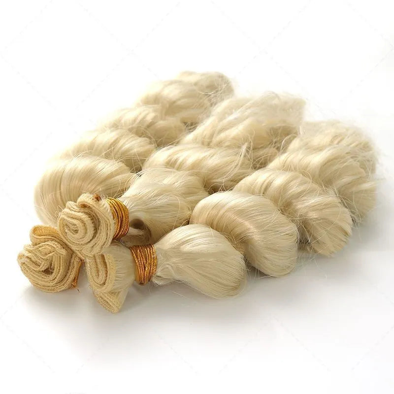 Golden synthetic wig on a stand showing long, straight high-temperature chemical fibre weft.