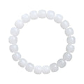 White jade barrel bead bracelet on wrist showing traditional Hetian jade material and barrel-shaped bead design