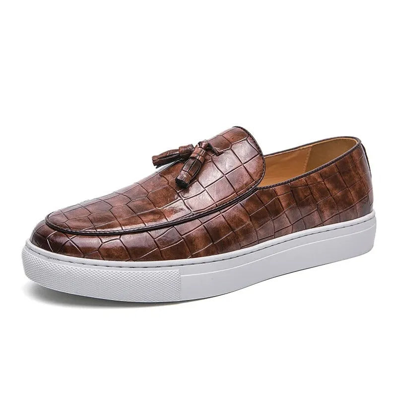Men's plus-size black tassel sneakers with round toe and rubber sole on a white background.