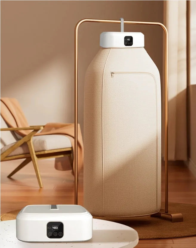 White cylindrical foldable electric clothes dryer with remote control, shown in open position