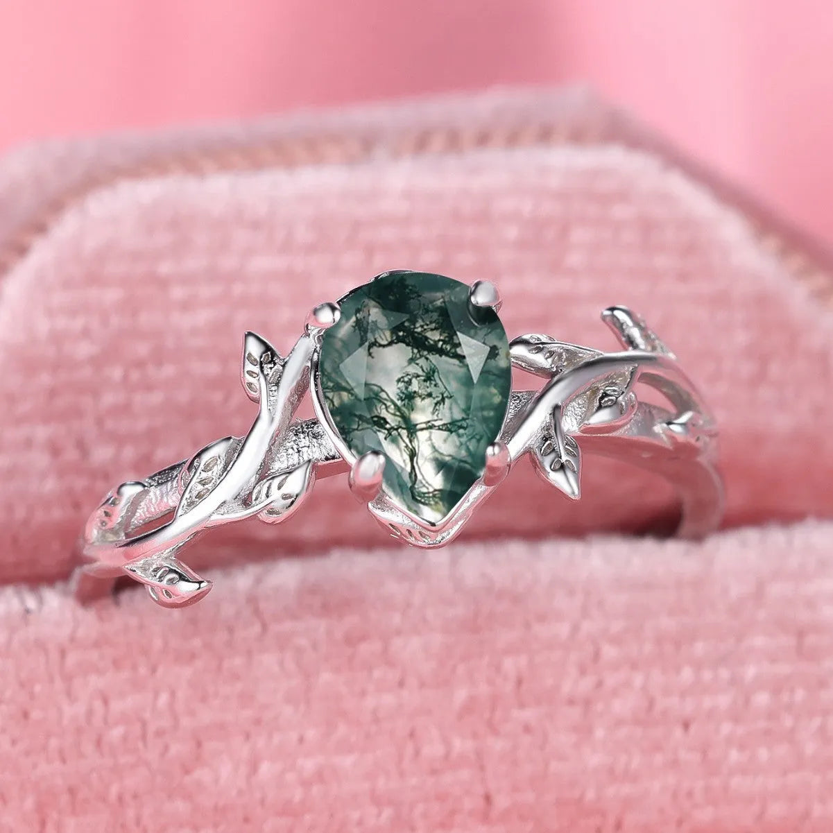 S925 silver drop-shaped agate edge branch leaf ring on white background, sterling silver band with natural stone