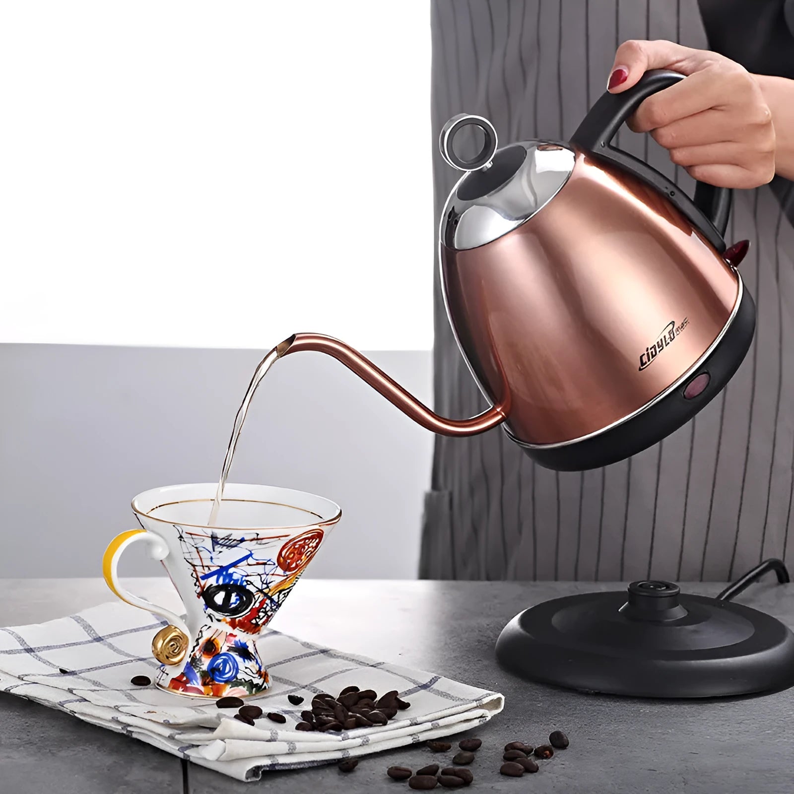Gold full-automatic stainless steel electric kettle with touch controls and 1 litre capacity.