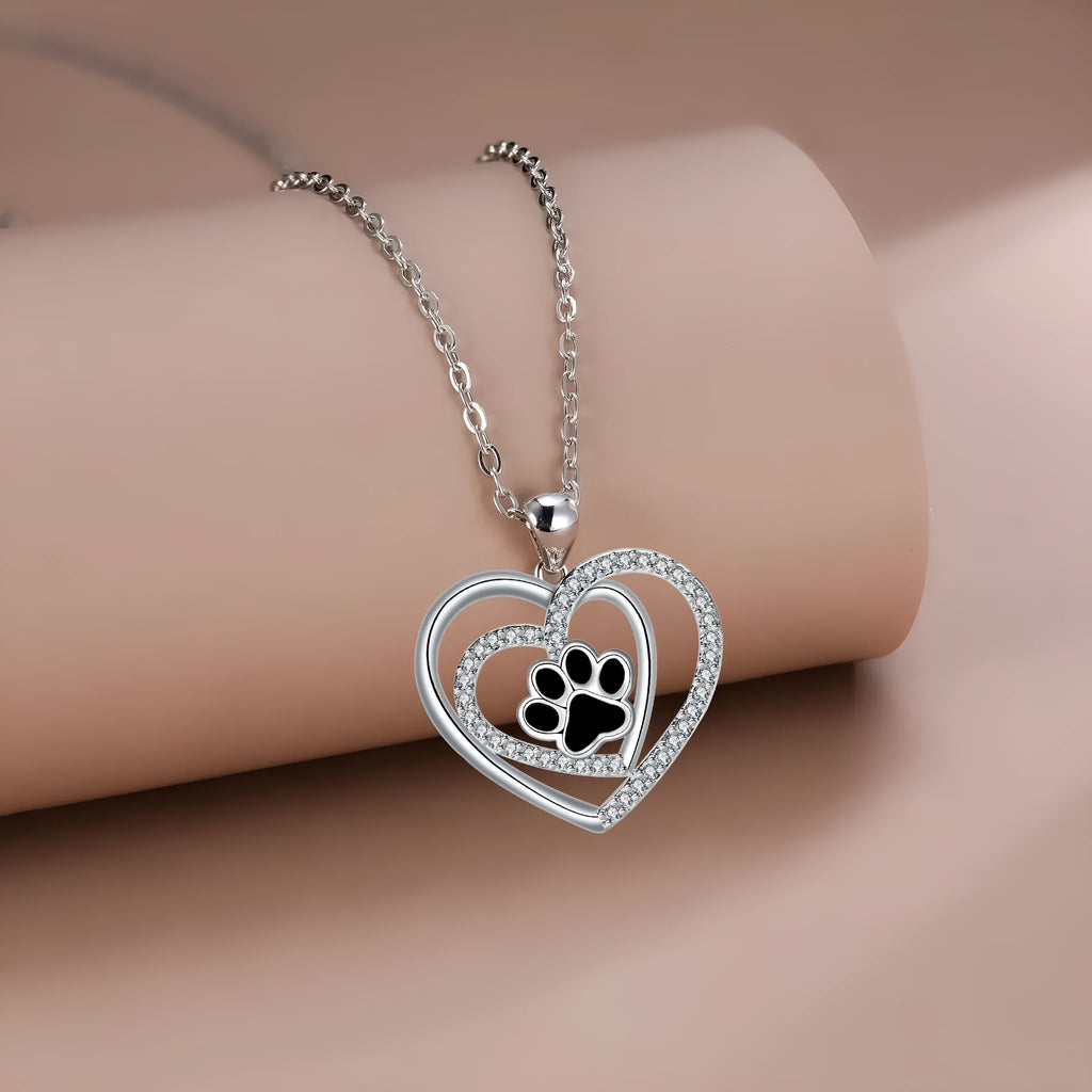 Women's dog paw print heart necklace on a cross chain, copper electroplated.