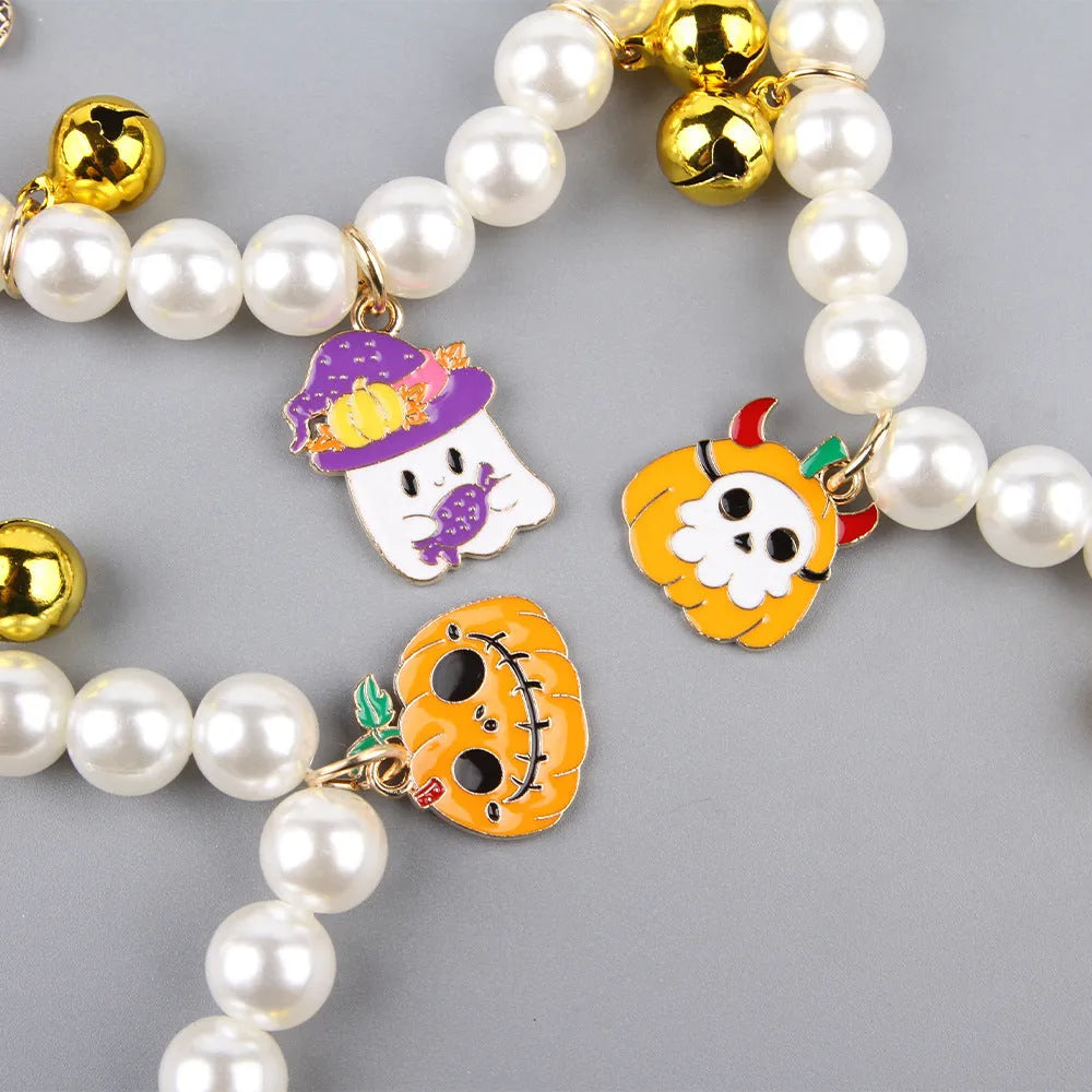 Halloween decorative pet collar with simulated pearl necklace and pumpkin designs in purple, black, and orange.
