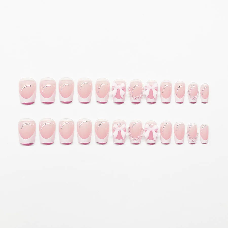 Artificial French manicure nail set with bow decorations and multiple patterns