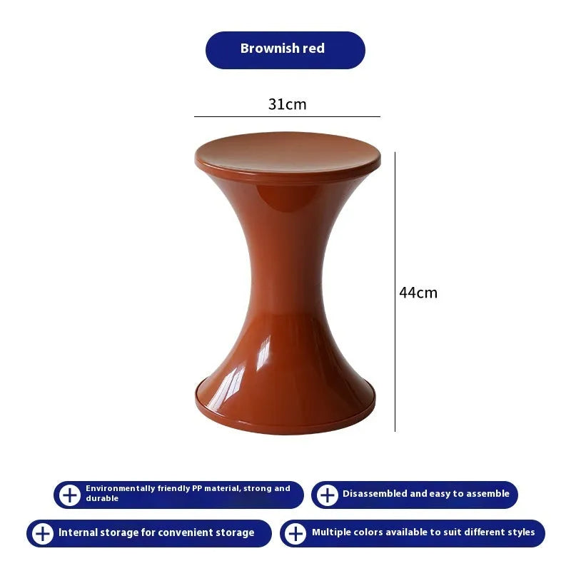 Hourglass-shaped plastic shoe changing stool in a choice of five colours: black, green, red, white, brown.