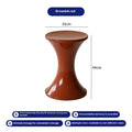 Hourglass-shaped plastic shoe changing stool in a choice of five colours: black, green, red, white, brown.
