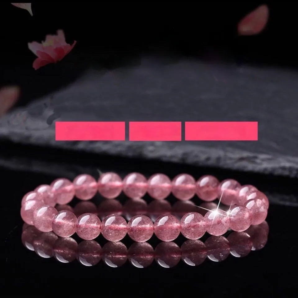 Women's strawberry quartz bracelet with polished beads on elastic string, shown in 6mm, 8mm, and 10mm size options.