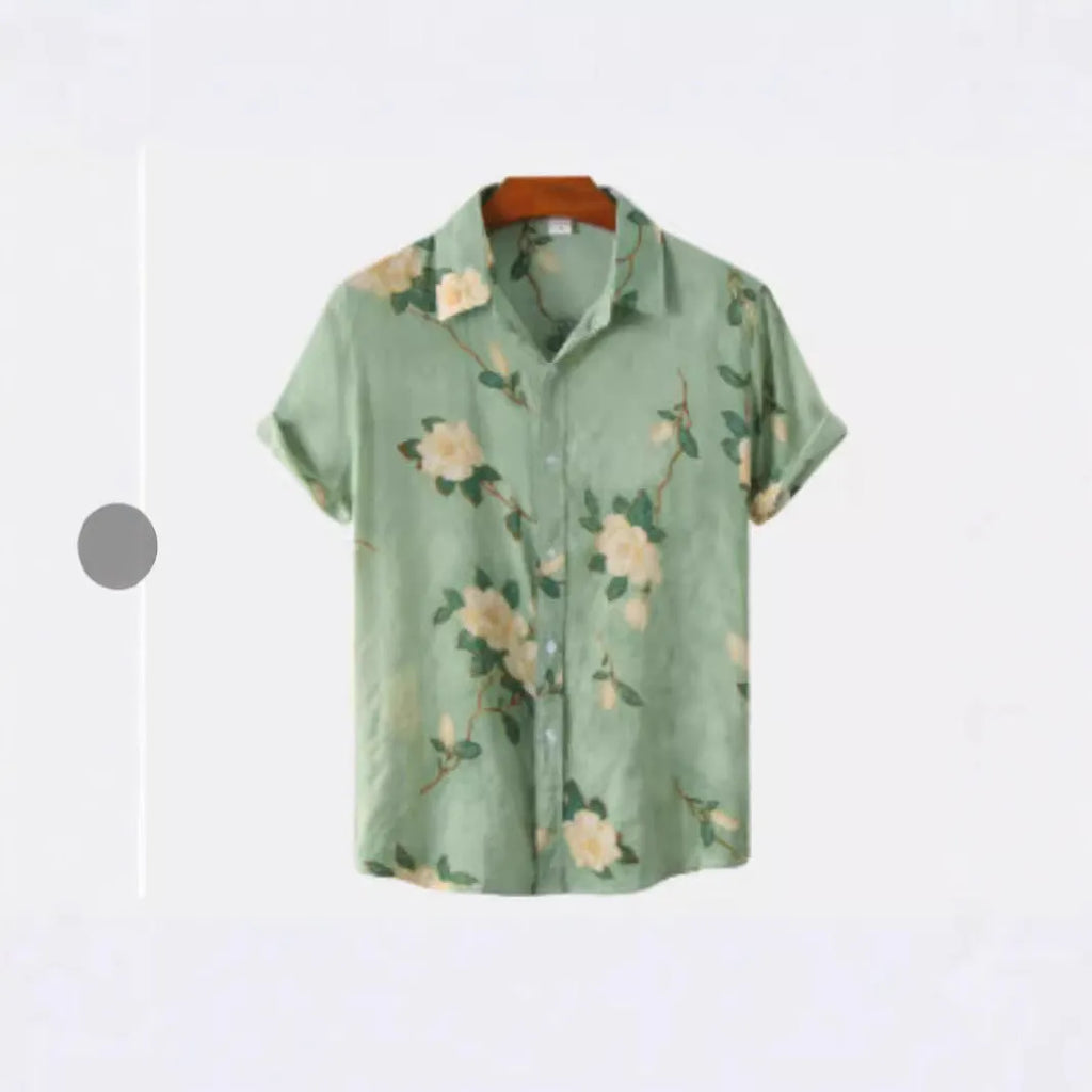 Man wearing a short sleeve Hawaiian shirt with a blue and white floral digital print and a lapel collar.