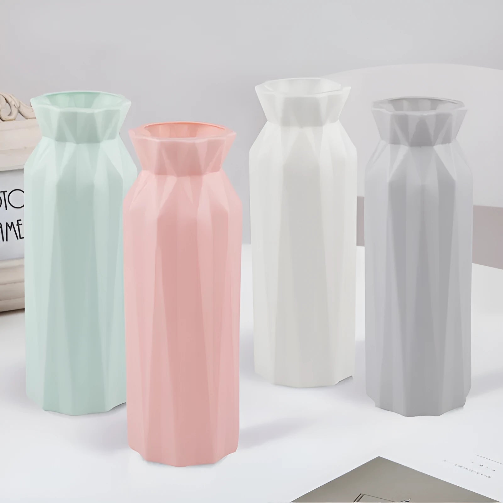 Green melamine drop-resistant vase with a wide base on a wooden table