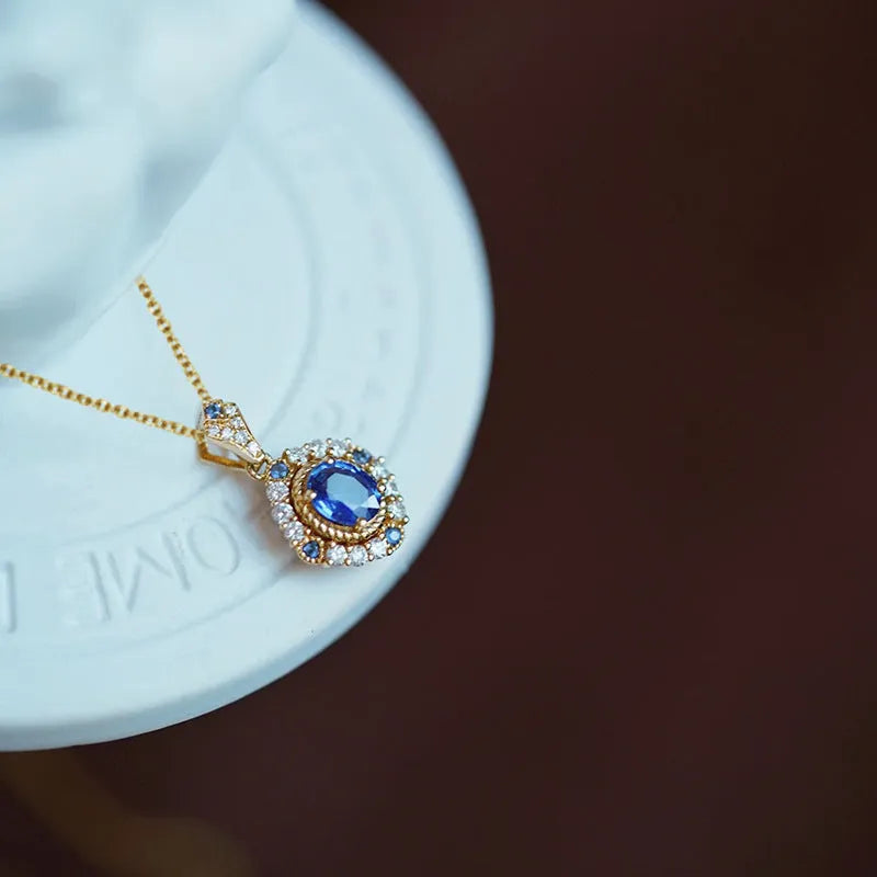 Golden women's necklace with mixed gemstone pendant on adjustable box chain
