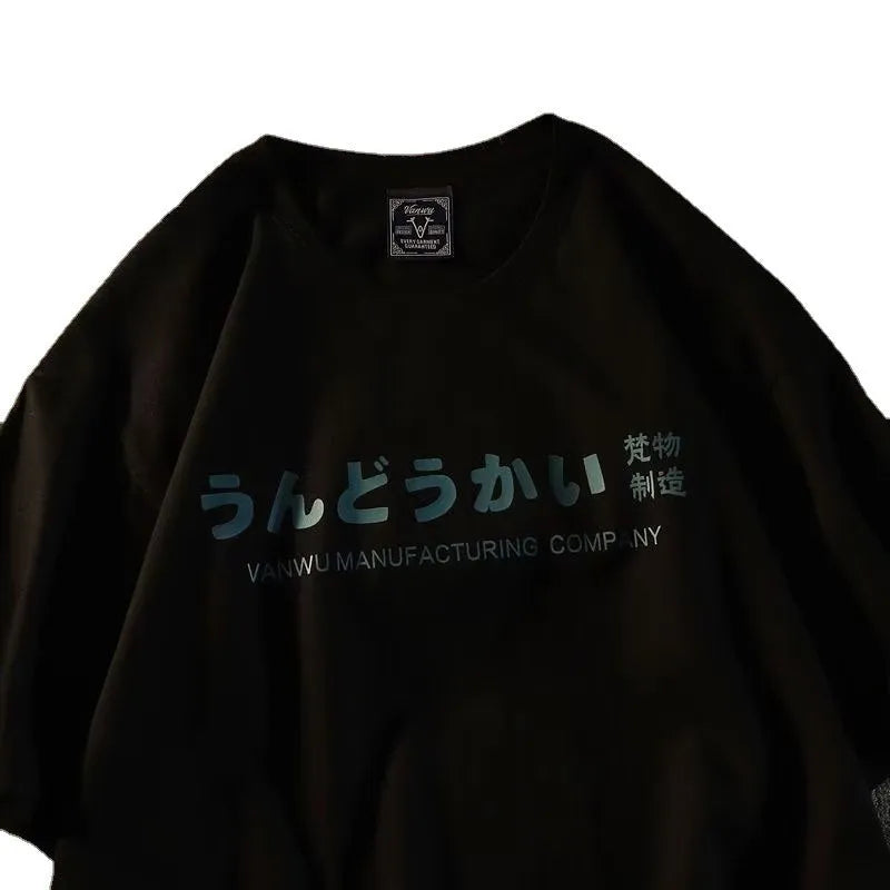 Loose fit cotton short sleeve t-shirt with letter print in black, shown on a hanger.