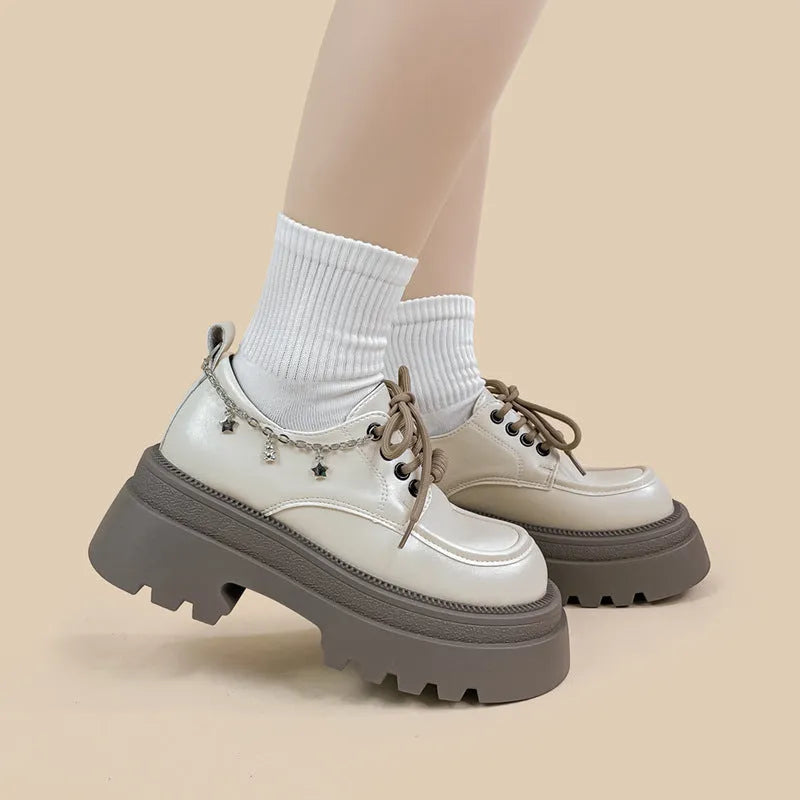 White women's platform Mary Jane shoes with round toe, chunky heel, and front lace-up in British college style.