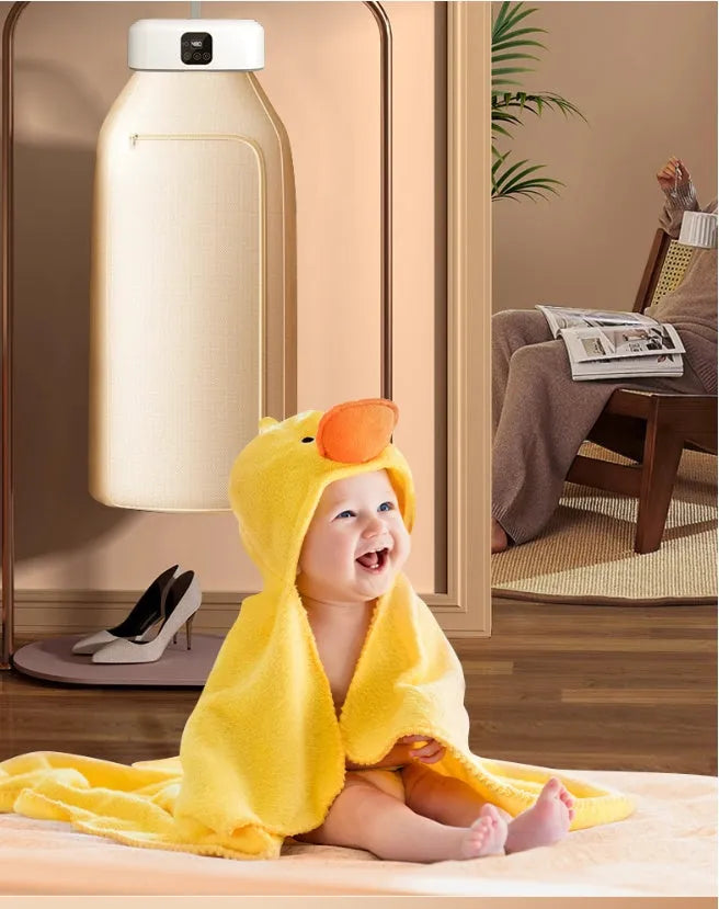 White cylindrical foldable electric clothes dryer with remote control, shown in open position