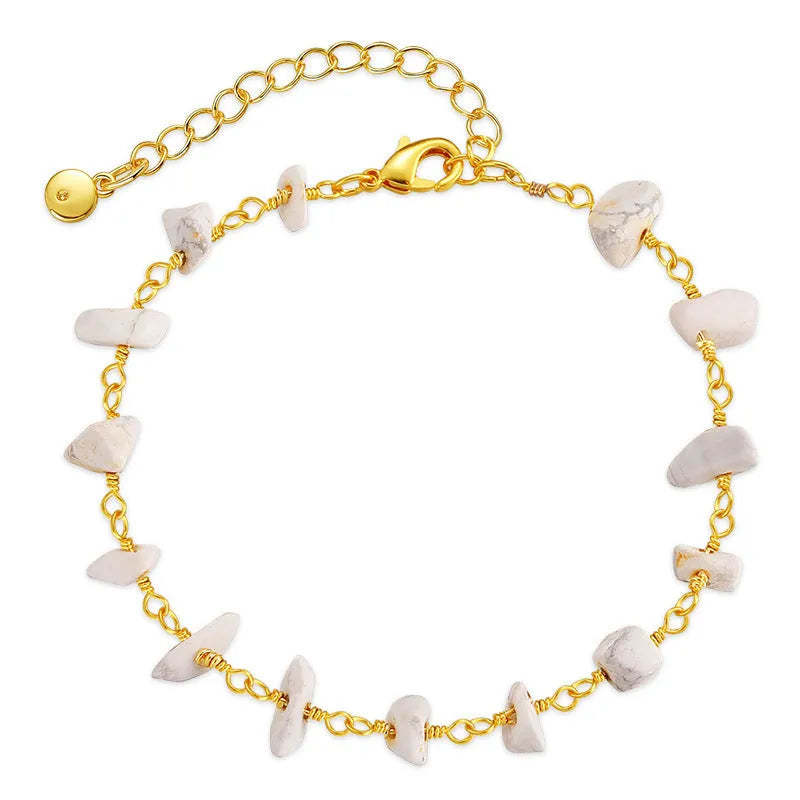 Geometric women's bracelet with irregular turquoise stones and crystal details on 18K copper