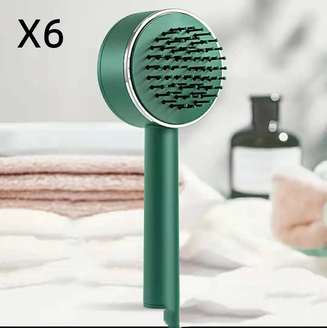 Plastic air cushion comb with long handle in white, green, and pink colours for hair detangling and styling