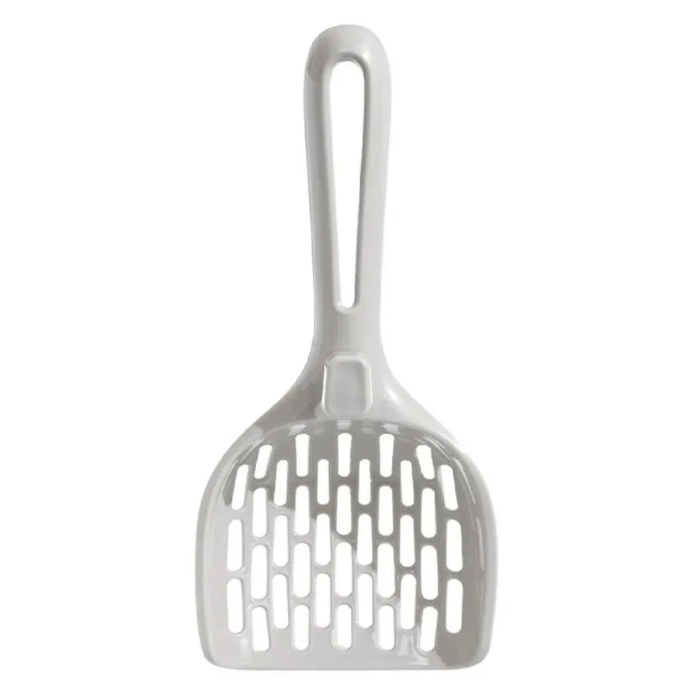 Grey plastic cat litter scoop with integrated base on a white background