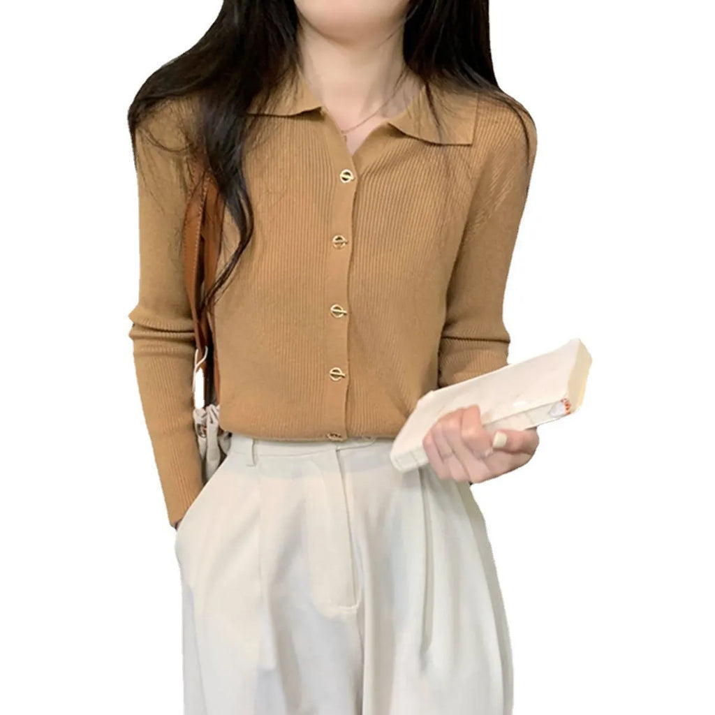 A woman wearing a loose-fit, long-sleeved knitted cardigan in a beige colour, showcasing its drape and cardigan style.