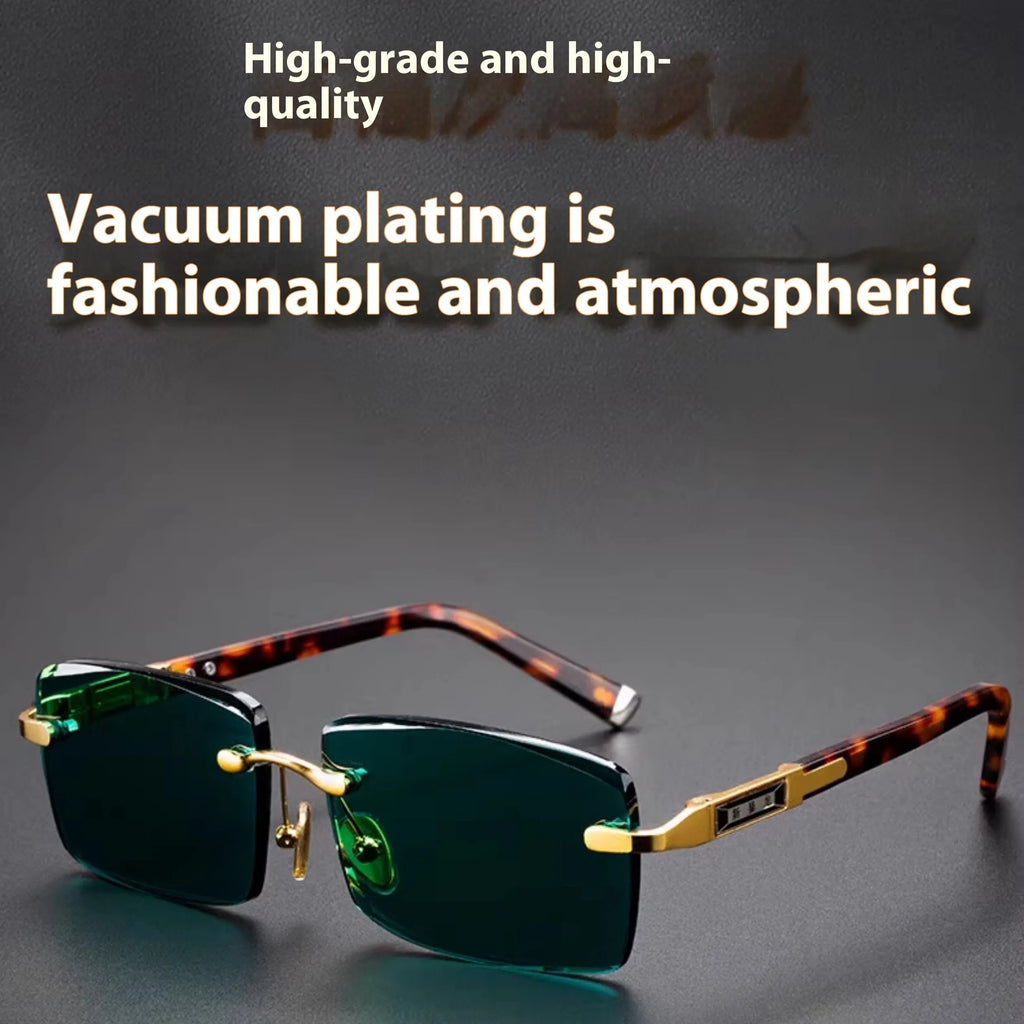 Frameless dark green crystal sunglasses shown with a glasses case and a lens cloth.