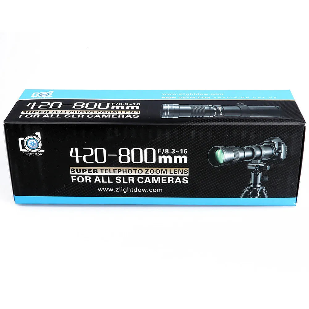 420-800mm manual telephoto zoom camera lens with T-mount adapter on a grey background.