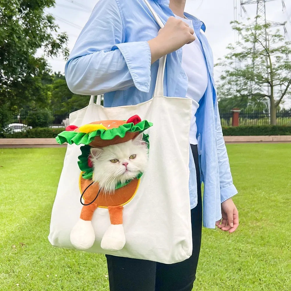 Canvas pet carrier shoulder backpack with cartoon pattern for small dog or cat transport.