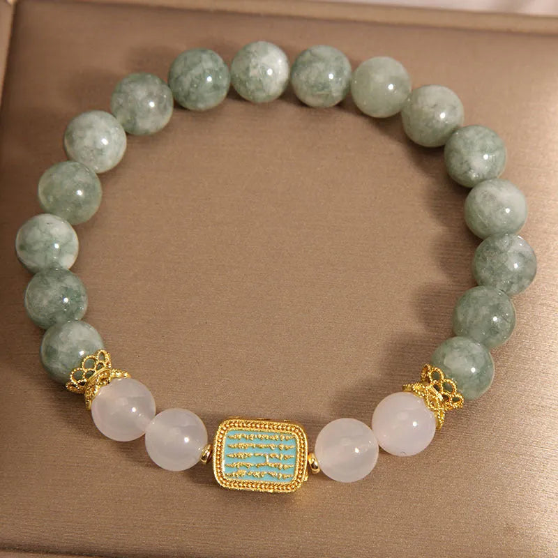 Women's oil green emerald crystal bracelet with five scriptural charms on wrist