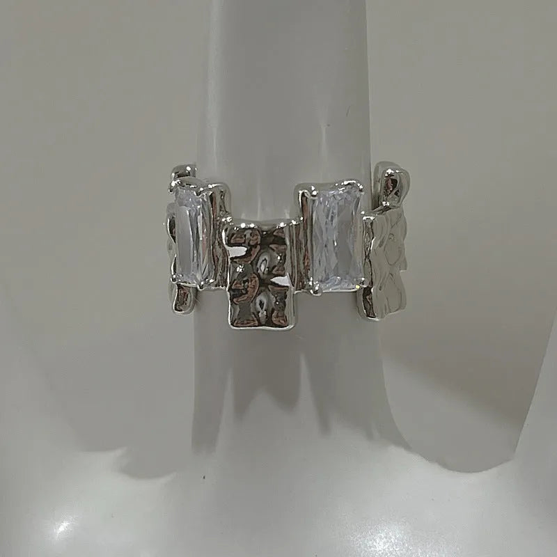 Silver open ring with cross zircon stones and geometric design