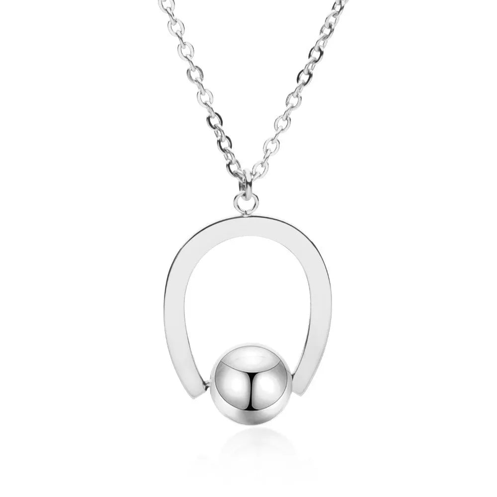 Adjustable stainless steel necklace with geometric pendant on a cross chain in gold finish.